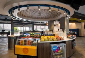 a store with a food counter in a cafeteria at Tru By Hilton Novi Detroit in Novi