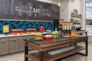 a kitchen with a table with food on it at Hampton Inn Delray Beach in Delray Beach