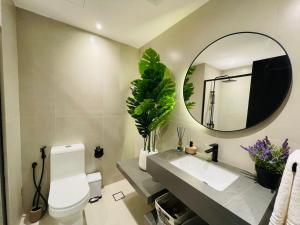 a bathroom with a sink and a mirror at Premium Studio I Discovery Gardens in Dubai
