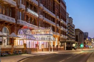 a building with christmas lights on the side of it at DoubleTree By Hilton Brighton Metropole in Brighton & Hove