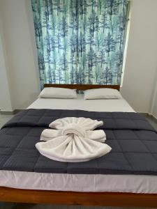 Surya cafe and stay sea view客房内的一张或多张床位