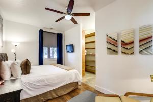 een slaapkamer met een bed en een plafondventilator bij Heber City Home Private Yard and Hot Tub! in Heber City