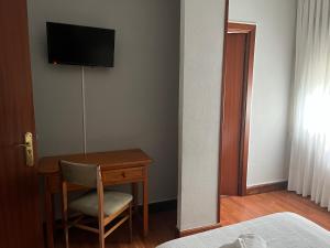 Un televizor și/sau centru de divertisment la Bakiola
