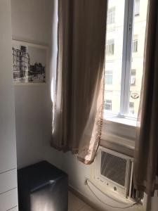 a window in a room with a radiator and a window at Apartamento Copacabana Posto5 in Rio de Janeiro