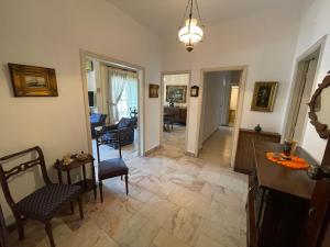 a living room with chairs and a dining room at New Jdeideh, Including Generator, Furnished Apartment, Parking, great location in Nahr al Mawt