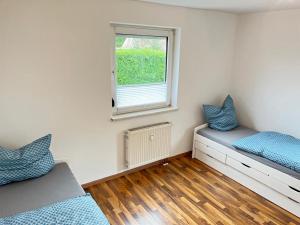 Postel nebo postele na pokoji v ubytování 4-h3rOeS Legoland Günzburg Wohnung 1