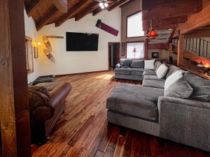 a living room with two couches and a flat screen tv at Family Haven in Graeagle CA w/King Bed Suite in Graeagle