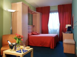 
Ein Bett oder Betten in einem Zimmer der Unterkunft Hotel Meridiana
