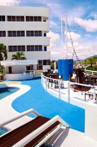 a pool on the roof of a hotel at Aquarius Hotel Boutique in Pampatar