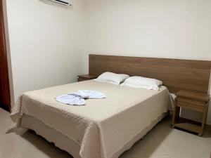 Postel nebo postele na pokoji v ubytování Hotel Skalla - MELHOR CUSTO BENEFICIO