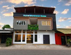 a store front of a hotelmonster home at Hotel Montanar HOME in La Dorada