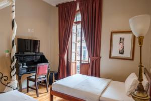 Katil atau katil-katil dalam bilik di Santa Lucia House - Forum