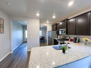 a kitchen with a sink and a counter top at Spacious 3 bedroom home in Longmont