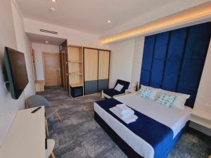 Телевизор и/или развлекательный центр в Hotel Nava