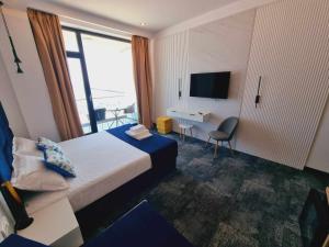 Телевизор и/или развлекательный центр в Hotel Nava