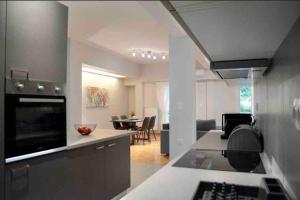 a kitchen and living room with a dining room at Athens heart city centre apartment in Athens +10 photos