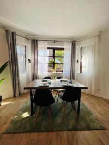 a dining room with a table and two chairs at Das Bergherz Ruhe + Natur pur in Reken