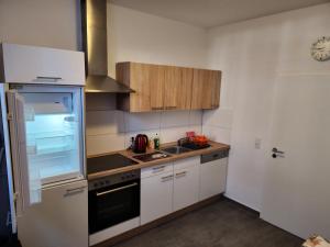 a kitchen with a sink and a stove top oven at MD- City, chic, Erdgeschoss, BESTPREIS- Leistung, wir bieten 1 Dreibettzimmer, plus DZ bis 5 Personen , Küche, Bad in Magdeburg