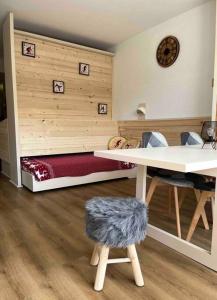 Postel nebo postele na pokoji v ubytování STUDIO Au pied des pistes - Les deux alpes