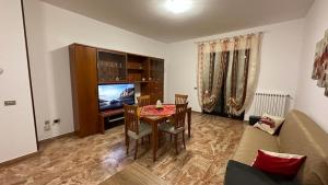 a living room with a table and a couch at Stella Marina in Montesilvano