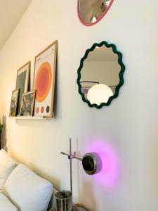 a room with a lamp and a mirror on the wall at Nordic! 1 Bedroom Apartment in Puerto de la Cruz