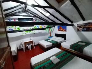 Postel nebo postele na pokoji v ubytování Ccapaq Wasi