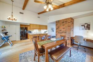 a kitchen and dining room with a table and chairs at Family-Friendly Broken Arrow Retreat with Yard! in Broken Arrow