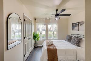 a bedroom with a bed and a ceiling fan at Modern Killeen Vacation Rental with Private Patio! in Killeen