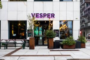 a restaurant with a sign on the front of a building at Spacious modern 2BR apartment at Central OSLO BARCODE in Oslo