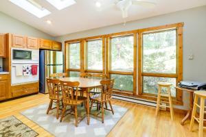a kitchen and dining room with a table and chairs at Spacious Woodbury Home with Pool and Hot Tub! in Woodbury