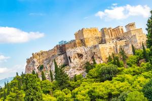 a castle on top of a mountain with trees at Citybreak Apartments 302 in Athens