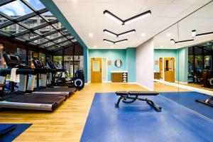 a gym with treadmills and elliptical machines at Sonesta Select Philadelphia Airport in Philadelphia