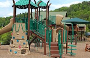 a playground with a slide in a park at Westgate Smoky Mountain Resort & Water Park in Gatlinburg