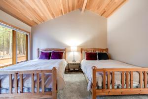 Letto o letti in una camera di Tree-lined Paradise