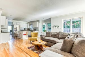 a living room with a couch and a table at Raleigh Hills Retreat in Portland