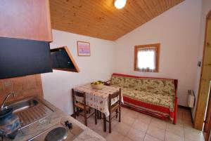 a living room with a couch and a table at Caravelle Camping Village in Ceriale