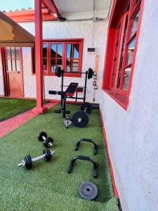 a room with a bunch of equipment on the grass at HOSTAL 469 in La Serena