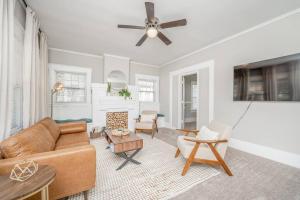 a living room with a couch and a ceiling fan at 4 Bed 2 Bath Home by College Hill and Hospitals in Wichita