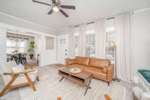 a living room with a couch and a table at 4 Bed 2 Bath Home by College Hill and Hospitals in Wichita