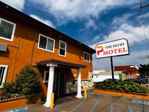 a hotel sign in front of a building at The Patio Motel - Los Angeles, LAX in Gardena