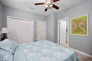 a bedroom with a bed and a ceiling fan at Luxury 3 Bed 2 Bath 2nd Floor Condo By Beach in South Padre Island