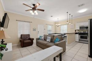 a living room with a couch and a kitchen at Luxury 3 Bed 2 Bath 1st Floor Condo Near Beach in South Padre Island