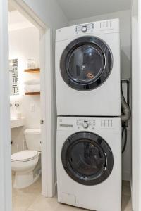 a washer and dryer in a bathroom with a toilet at ASH and KO in Phoenix