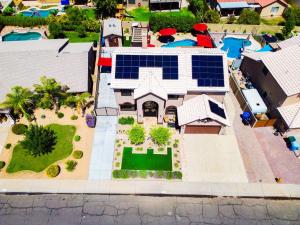 an aerial view of a house with solar panels on it at Family Home Vacation Retreat Glendale AZ in Phoenix