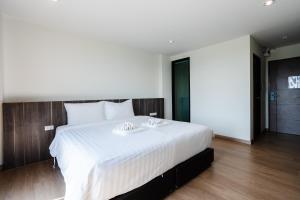 Postel nebo postele na pokoji v ubytování JS HOTEL