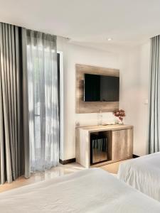 Giường trong phòng chung tại La Sera Suites Nha Trang