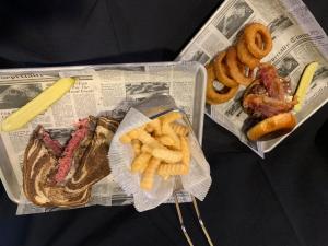 un giornale con patatine fritte e diversi tipi di cibo di Holiday Inn Cincinnati-Riverfront, an IHG Hotel a Covington