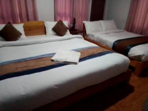 Letto o letti in una camera di Heritage Home Dhulikhel