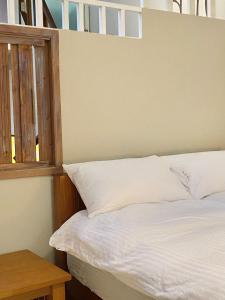Ліжко або ліжка в номері 寵物友善九份沐石原宿一館mu shi b&b