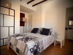 A bed or beds in a room at Apartamento Flor Még 2 kép